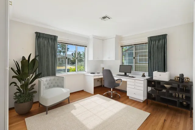a view of a house with backyard and a garden