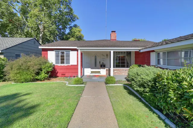 a front view of a house with yard