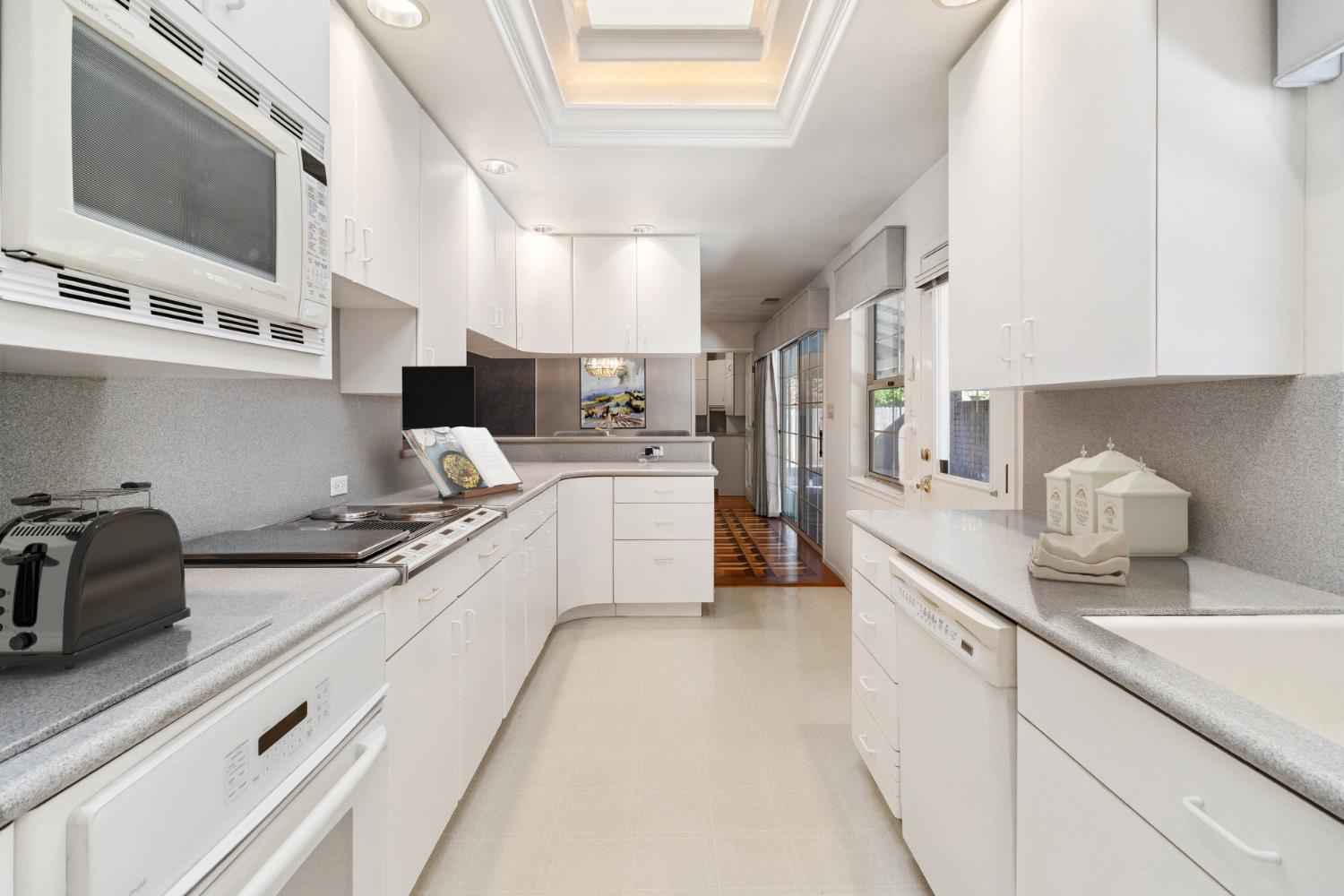 2953 Leta Lane Sacramento, CA 95821 - Photo 10 of 41 Virtually staged kitchen with assessories on counters