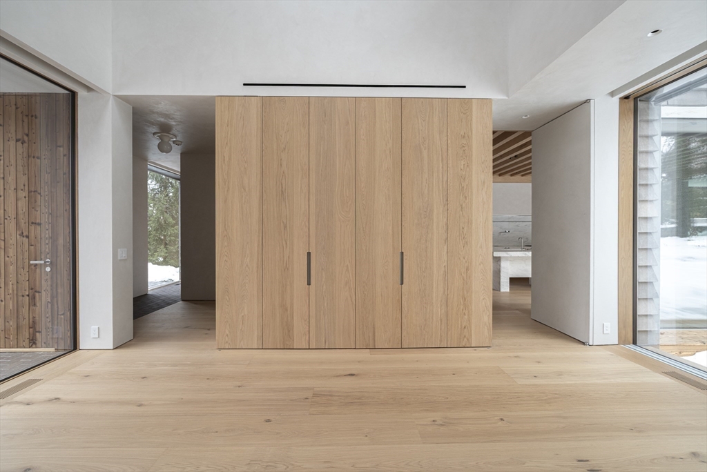 45 White Oak Road Wellesley, MA 02481 - Photo 25 of 38 a view of an empty room with wooden floor and a window