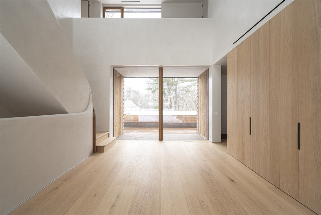 45 White Oak Road Wellesley, MA 02481 - Photo 27 of 38 a view of an empty room with wooden floor and a window