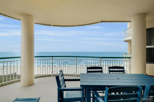 a view of a dining room with furniture and window
