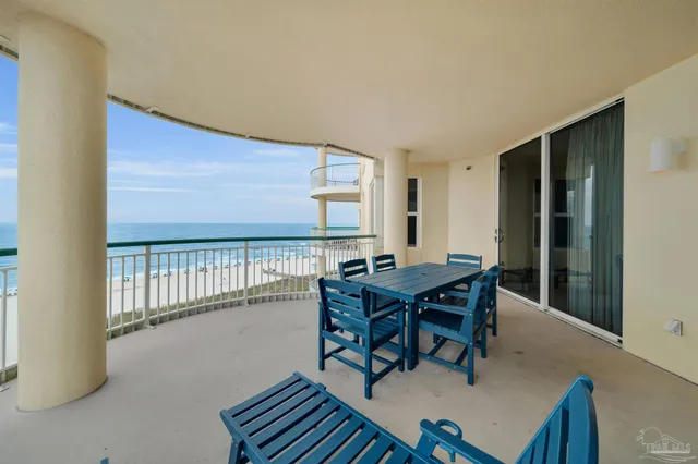 a view of a dining room with furniture and window