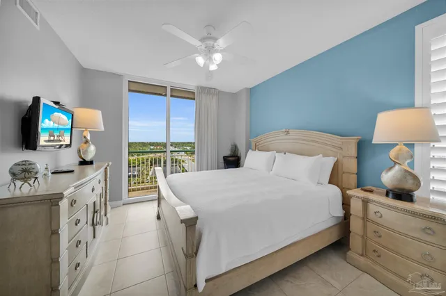 a bedroom with a bed a window and dresser