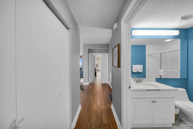 a view of a bathroom from the hallway