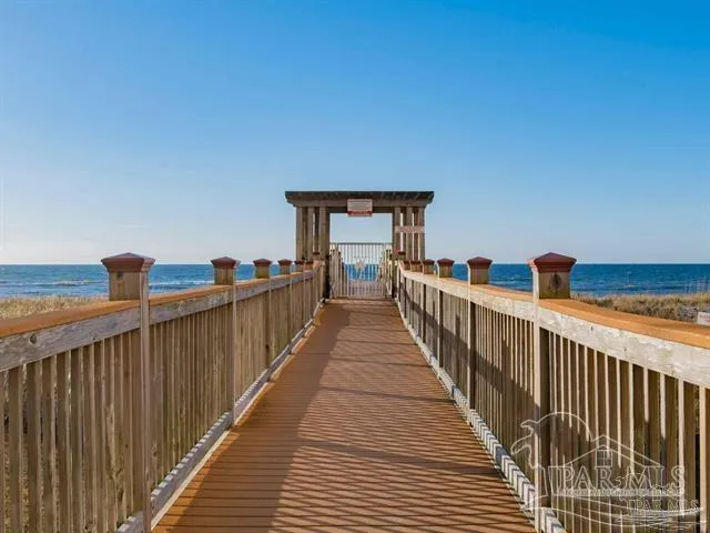 a view of a balcony with wooden floor