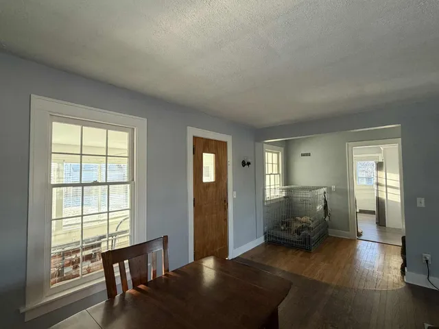 a view of a livingroom with furniture and windows