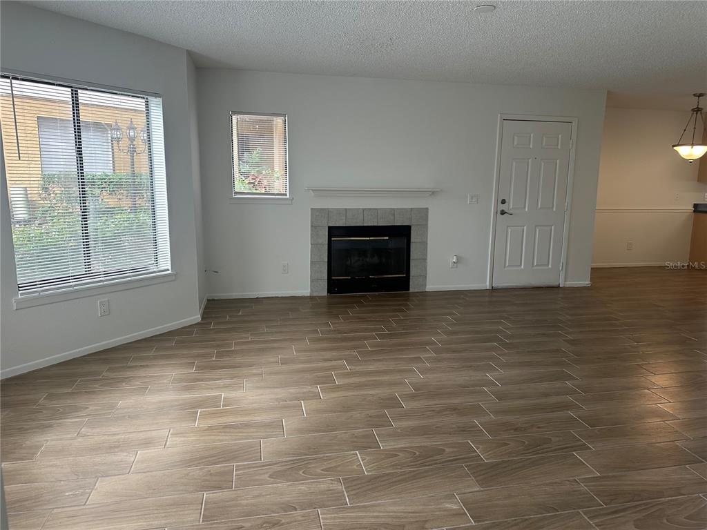 1550 South Belcher Road, Unit 412 Clearwater, FL 33764 - Photo 13 of 40 an empty room with windows and fireplace