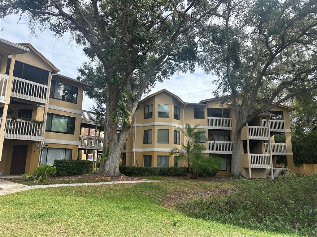 1550 South Belcher Road, Unit 412 Clearwater, FL 33764 - Photo 2 of 40 a front view of a house with a yard