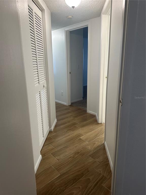 1550 South Belcher Road, Unit 412 Clearwater, FL 33764 - Photo 21 of 40 a view of a bathroom from a corridor