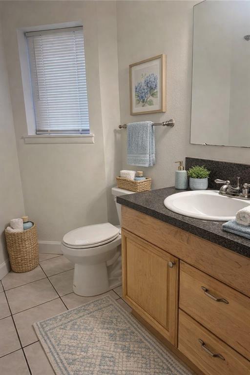 1550 South Belcher Road, Unit 412 Clearwater, FL 33764 - Photo 23 of 40 a bathroom with a toilet sink and mirror