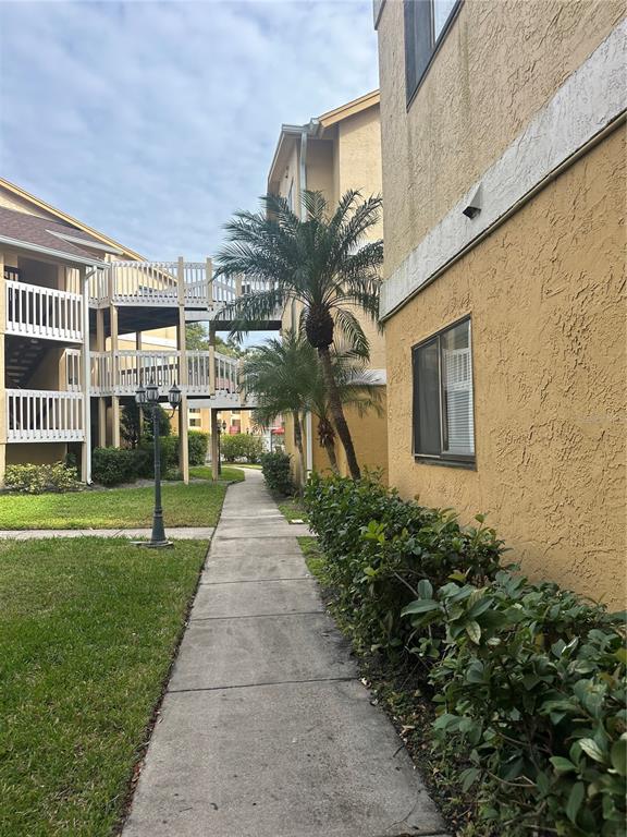 1550 South Belcher Road, Unit 412 Clearwater, FL 33764 - Photo 32 of 40 a front view of a house having yard