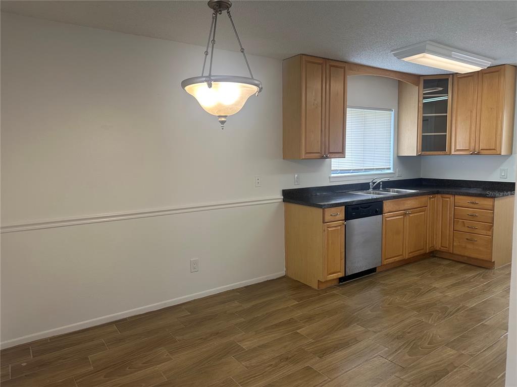 1550 South Belcher Road, Unit 412 Clearwater, FL 33764 - Photo 7 of 40 a kitchen with a sink cabinets and window