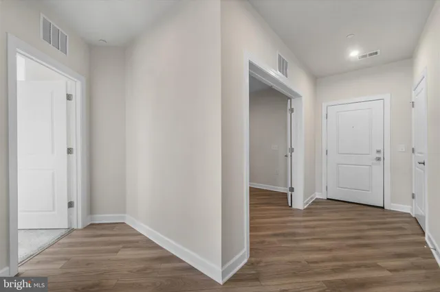 a view of a room with an empty space and sink