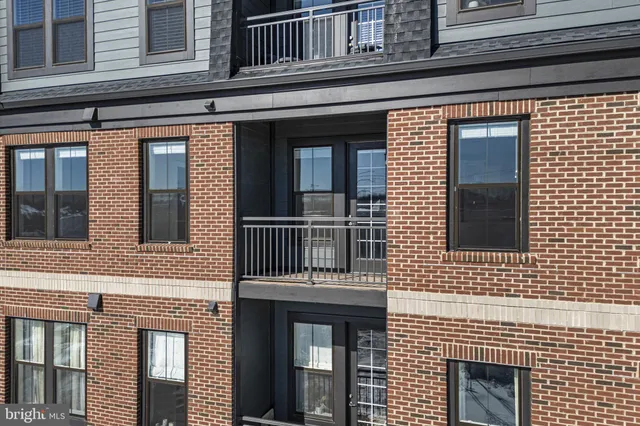 a view of a hallway with washer and dryer