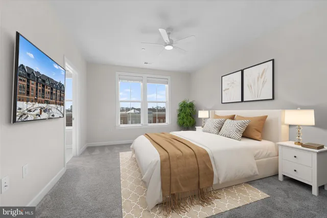 a bedroom with a large bed and a window