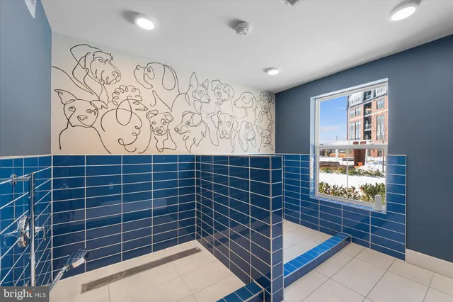 a living room with furniture and a bathroom