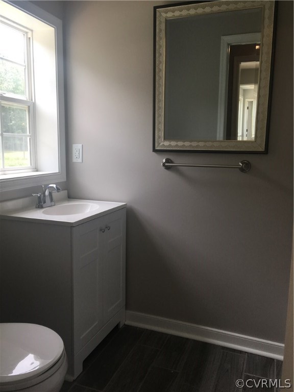 12900 Spring Run Road Midlothian, VA 23112 - Photo 14 of 21 a bathroom with a sink a toilet and mirror