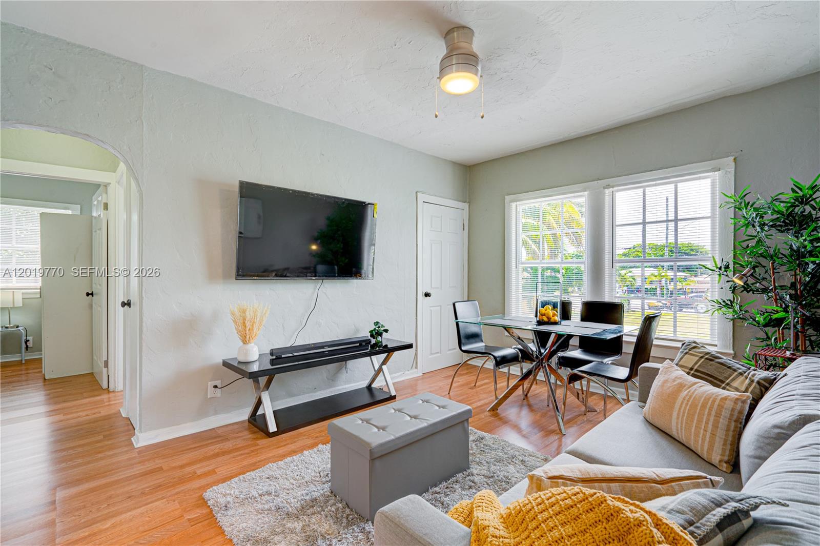 227 Southwest 30th Avenue, Unit B Miami, FL 33135 - Photo 6 of 15 a living room with furniture and a flat screen tv