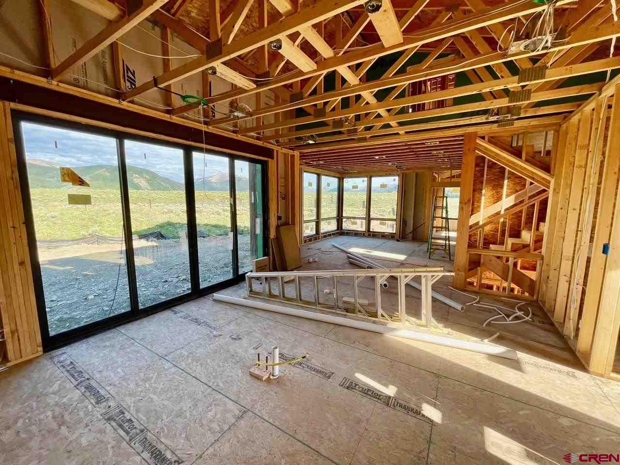 138 Elk Valley Road, Unit B Crested Butte, CO 81224 - Photo 13 of 19 a room with wooden walls and glass door