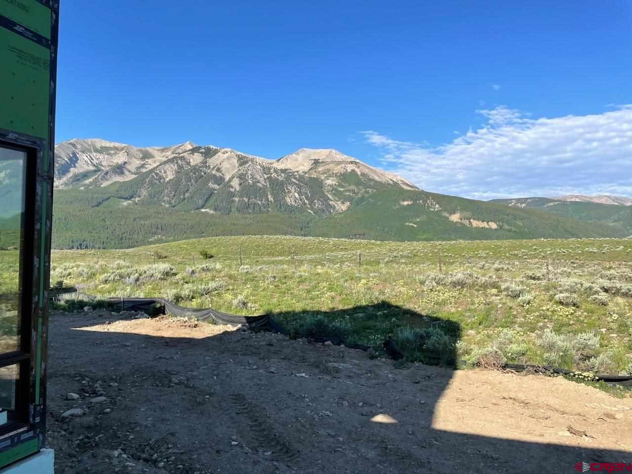 138 Elk Valley Road, Unit B Crested Butte, CO 81224 - Photo 15 of 19 a view of an ocean and a mountain
