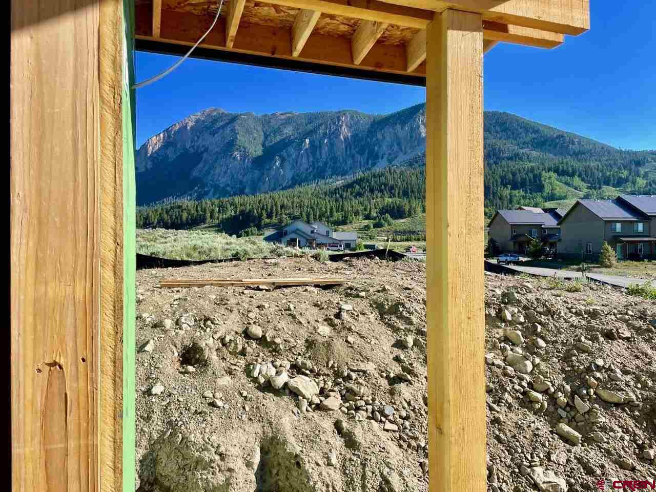 138 Elk Valley Road, Unit B Crested Butte, CO 81224 - Photo 17 of 19 a view of a backyard with a garden