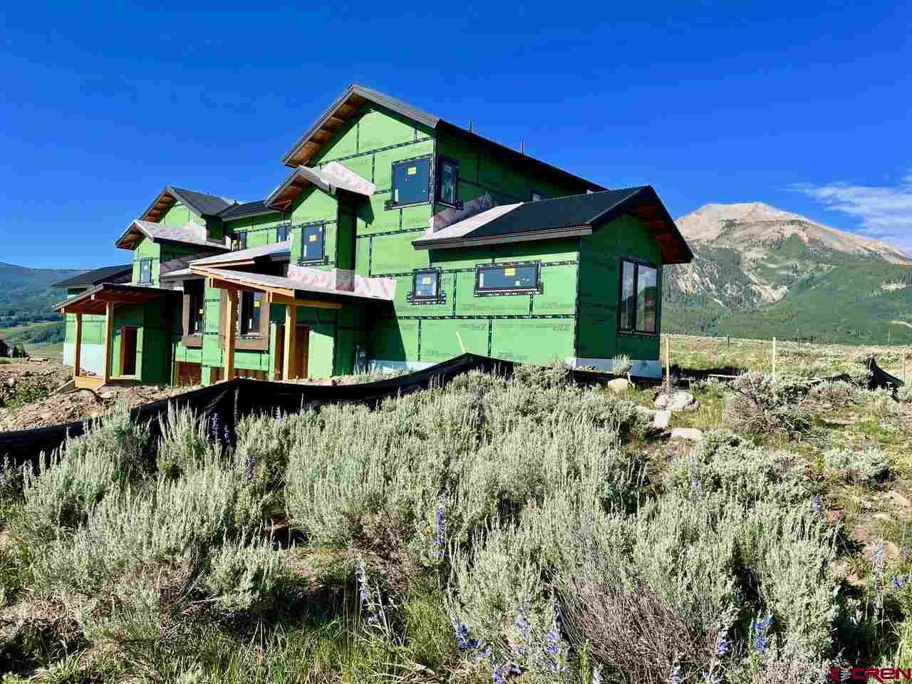 138 Elk Valley Road, Unit B Crested Butte, CO 81224 - Photo 18 of 19 a view of a house with a yard