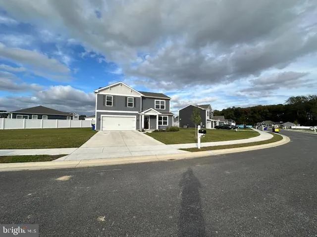 a view of building with river and trees in the background