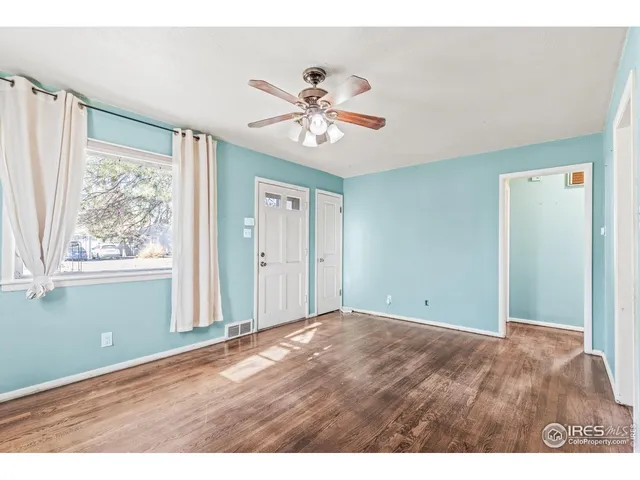 a view of an empty room with a window