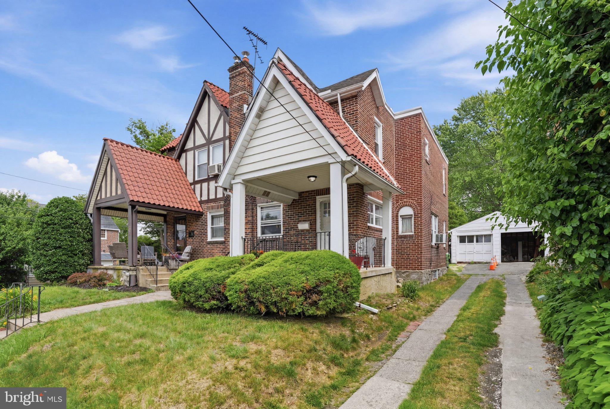 4686 State Road Drexel Hill, PA 19026 - Photo 1 of 21 Charming brick home with lush greenery.