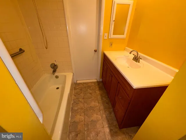 a bathroom with sink and a mirror