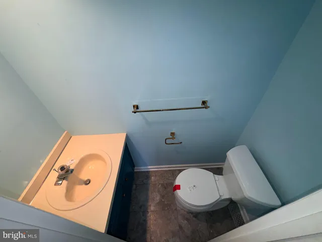 a kitchen with cabinets and white stainless steel appliances
