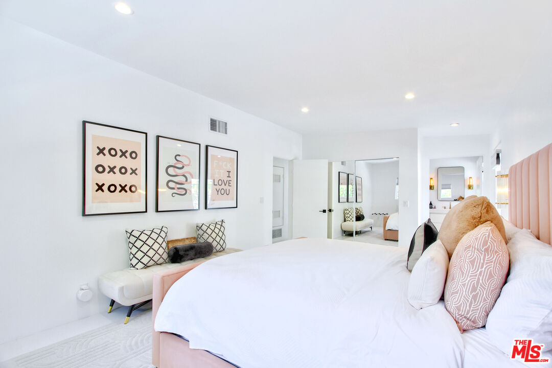 678 South Thornhill Road Palm Springs, CA 92264 - Photo 11 of 21 a bedroom with a bed and a couch