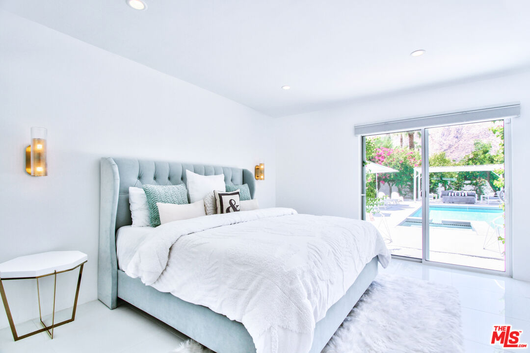 678 South Thornhill Road Palm Springs, CA 92264 - Photo 15 of 21 a bedroom with a bed and a large window