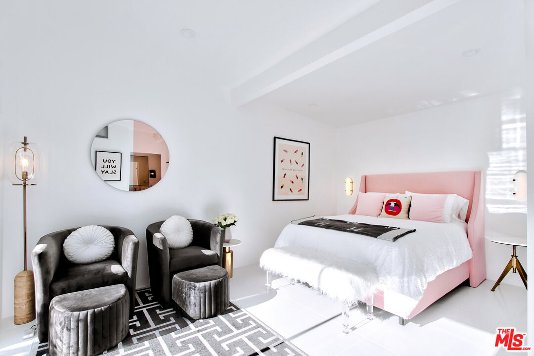 678 South Thornhill Road Palm Springs, CA 92264 - Photo 16 of 21 a bedroom with a bed and wooden floor