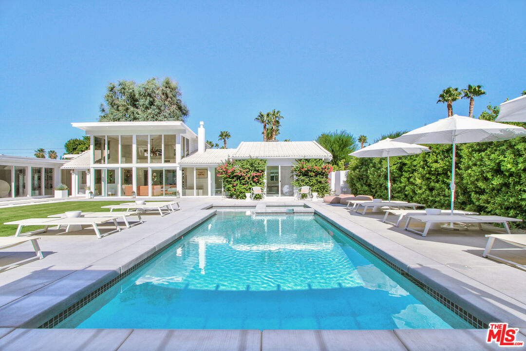 678 South Thornhill Road Palm Springs, CA 92264 - Photo 2 of 21 a view of a house with swimming pool and sitting area