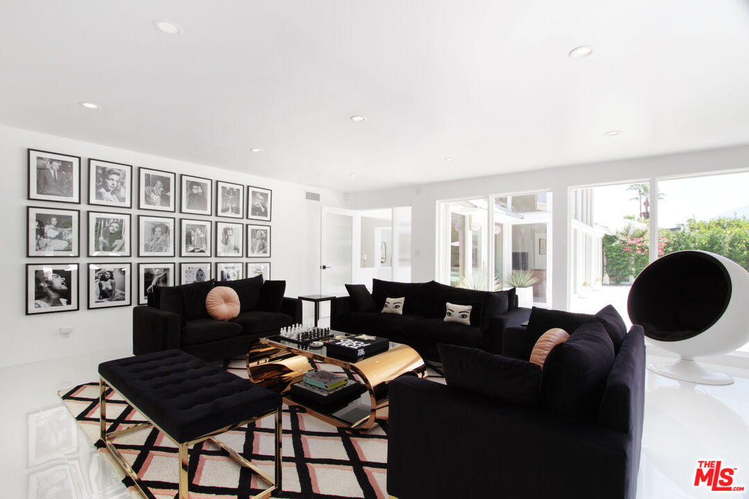 678 South Thornhill Road Palm Springs, CA 92264 - Photo 7 of 21 a living room with furniture and a window