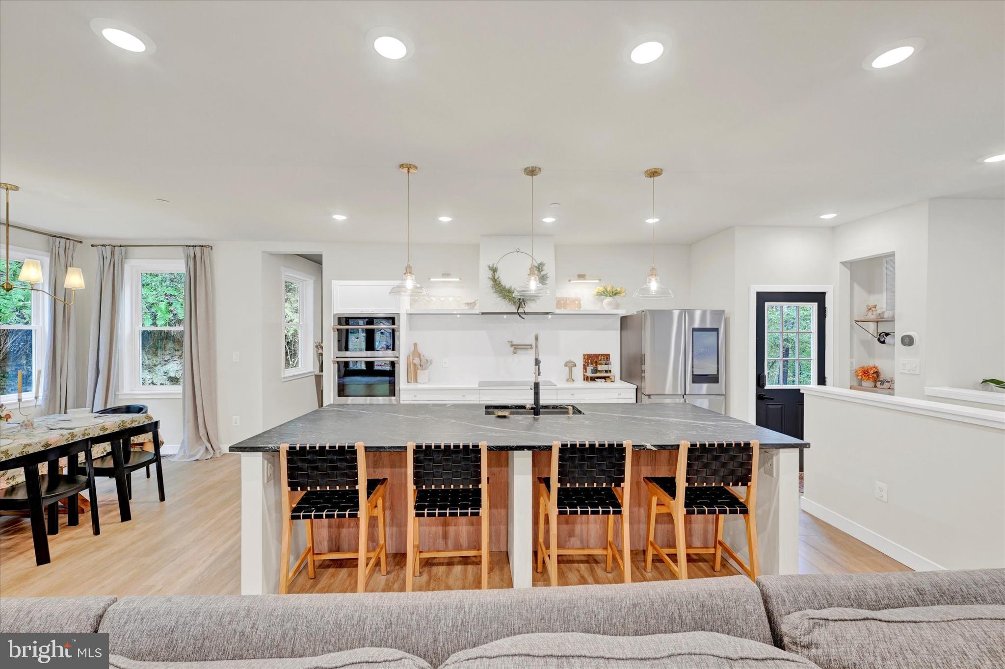 5437 Glen Arm Road Glen Arm, MD 21057 - Photo 16 of 45 a large kitchen with a table and chairs