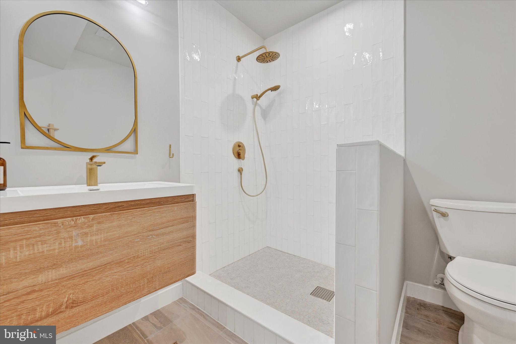 5437 Glen Arm Road Glen Arm, MD 21057 - Photo 24 of 45 a bathroom with a sink a toilet and a mirror