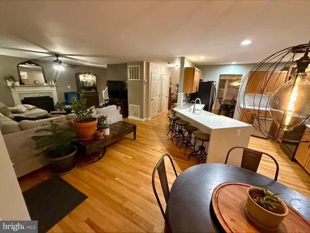 a living room with furniture and a mirror