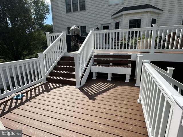 a view of outdoor space with deck and furniture