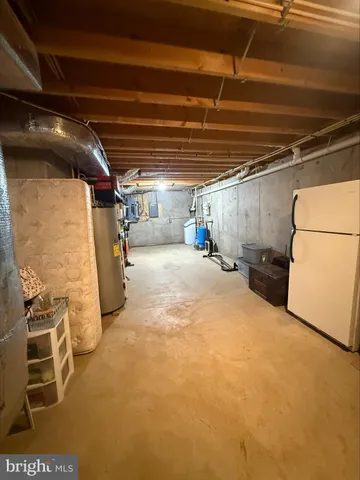 a view of empty room with wooden walls