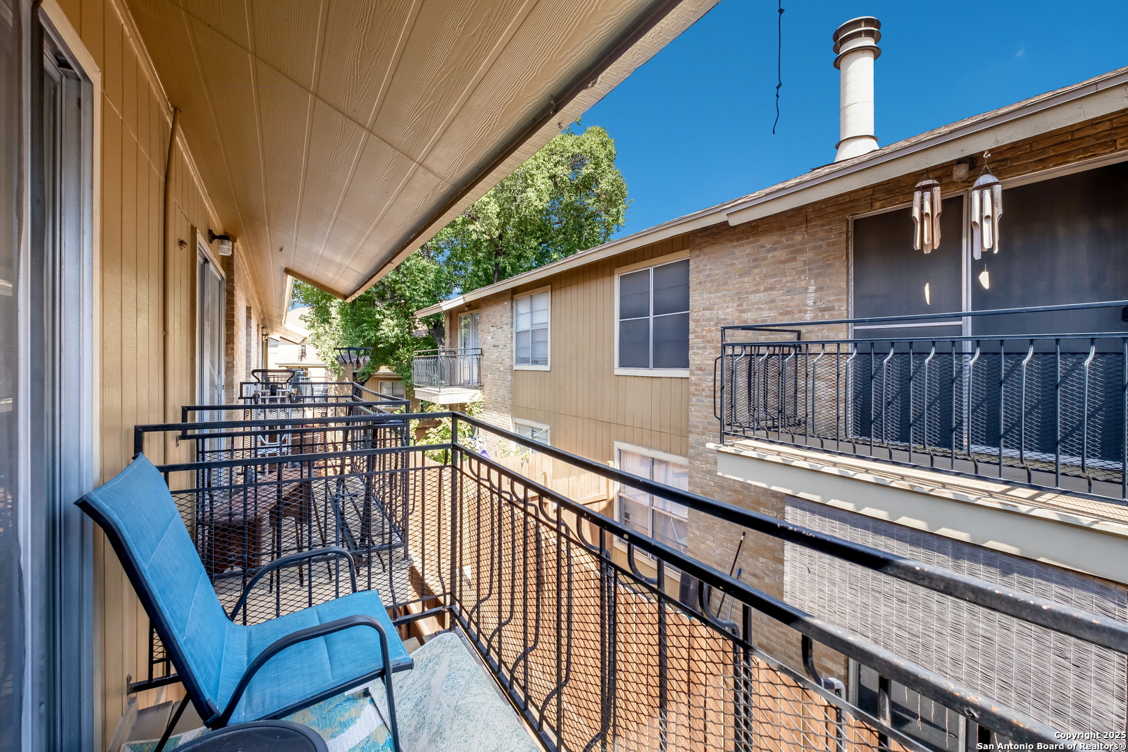 923 Vance Jackson Road, Unit 708 San Antonio, TX 78201 - Photo 13 of 18 a view of a house with wooden deck and furniture