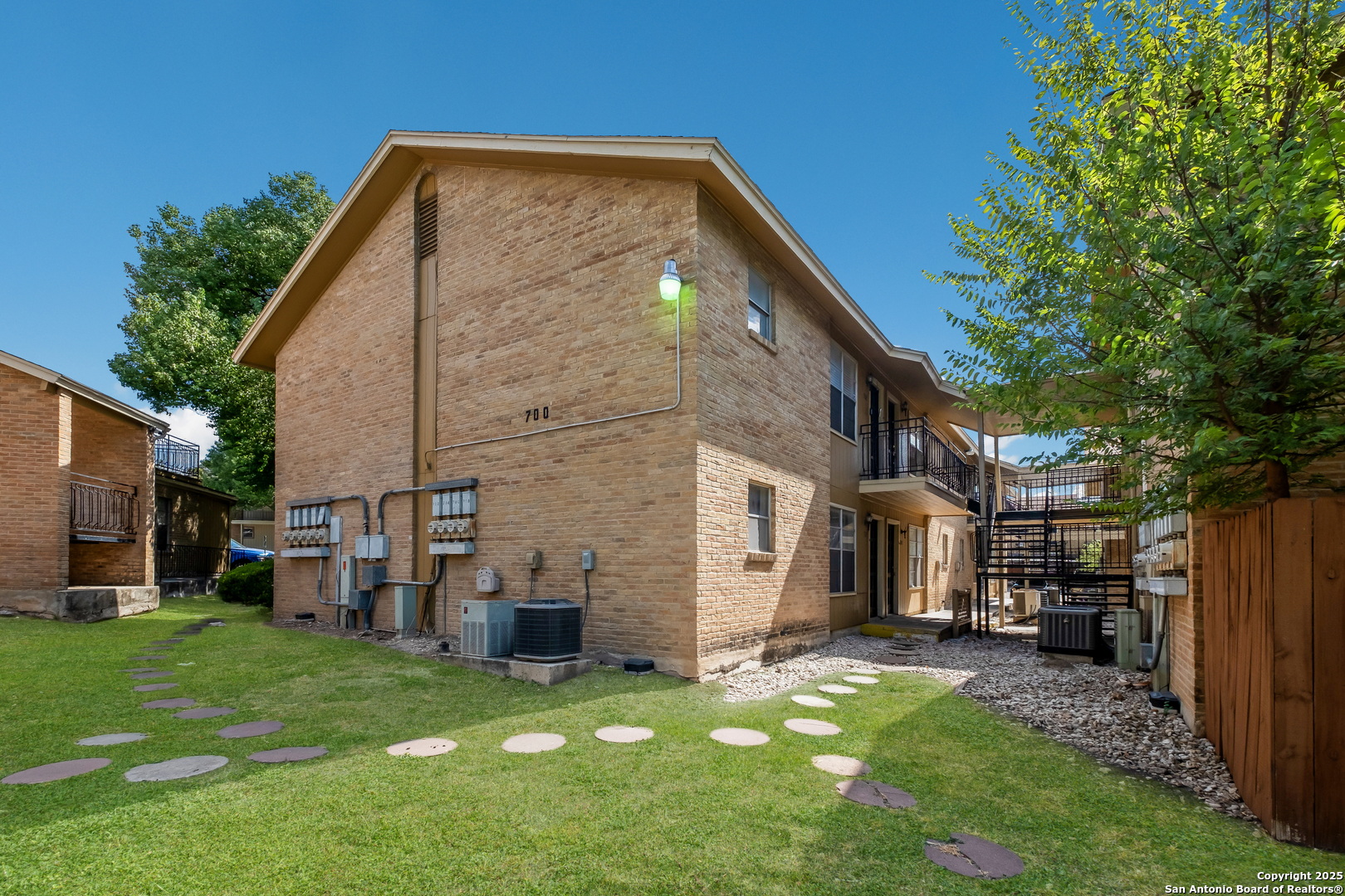 923 Vance Jackson Road, Unit 708 San Antonio, TX 78201 - Photo 17 of 18 a view of a house with a backyard