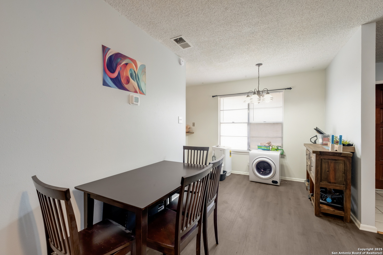 923 Vance Jackson Road, Unit 708 San Antonio, TX 78201 - Photo 4 of 18 a view of a dining room with furniture and window