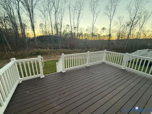 a kitchen with stainless steel appliances granite countertop a sink refrigerator and microwave