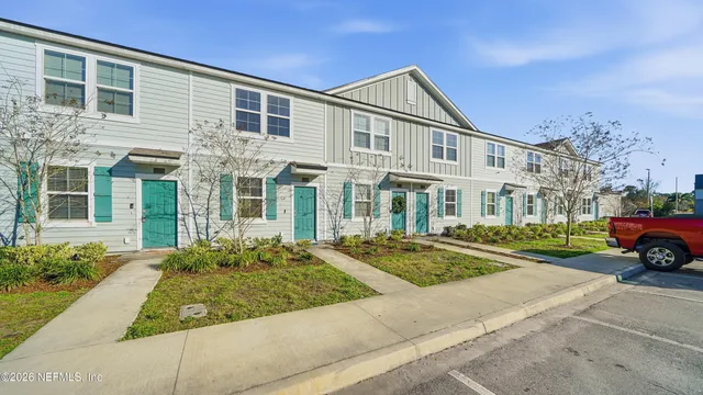 a front view of residential houses with street