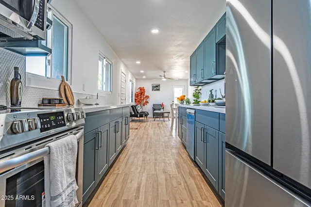 a kitchen with stainless steel appliances granite countertop lots of counter top space