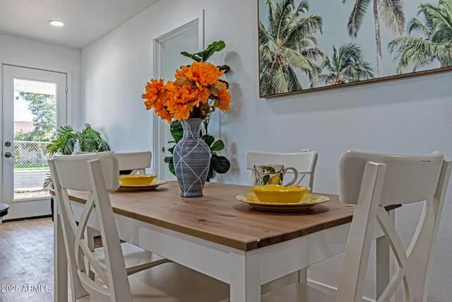 a view of a dining room with furniture and a chandelier