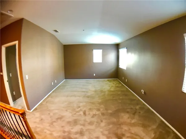 en empty room with windows